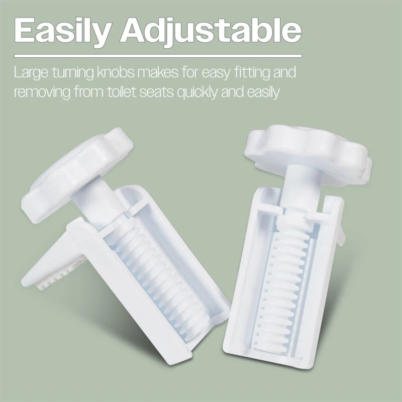 Close-up of adjustable white brackets for toilet seat installation.