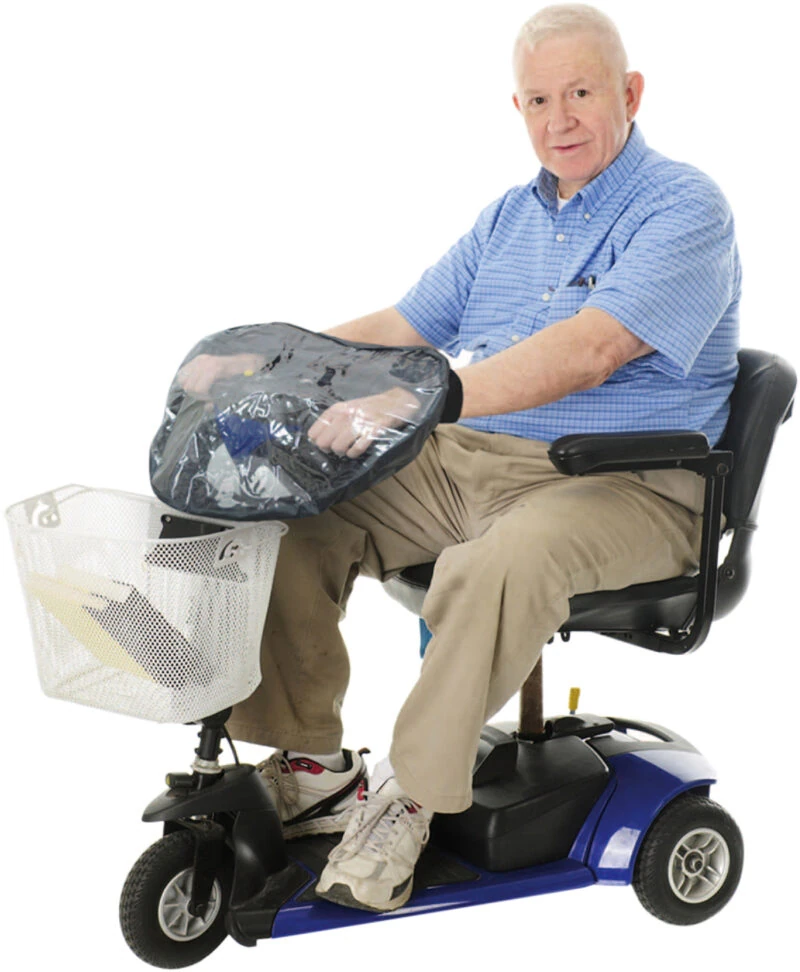 Man using a mobility scooter with a tiller cover.