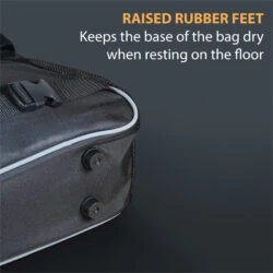 Close-up of a scooter bag with raised rubber feet and a buckle.