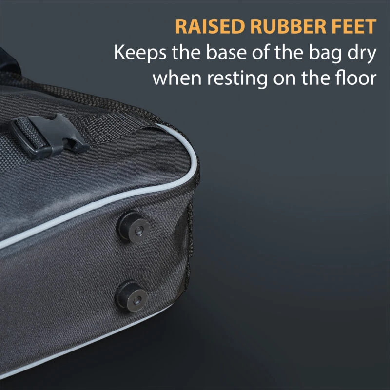 Close-up of a scooter bag with raised rubber feet and a buckle.