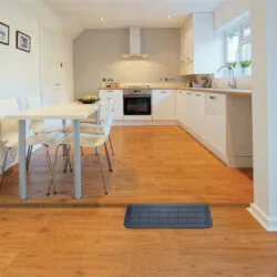 A threshold ramp placed in a kitchen doorway.
