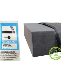 Wheelchair cushion with fire-resistant label and lab certified badge.