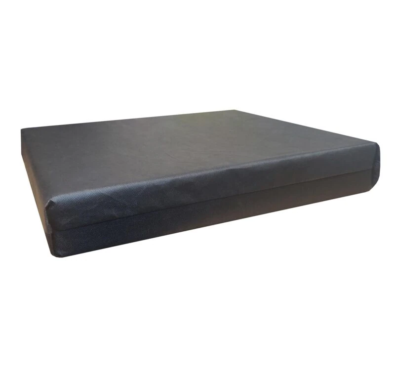 Black wheelchair cushion with a smooth surface.