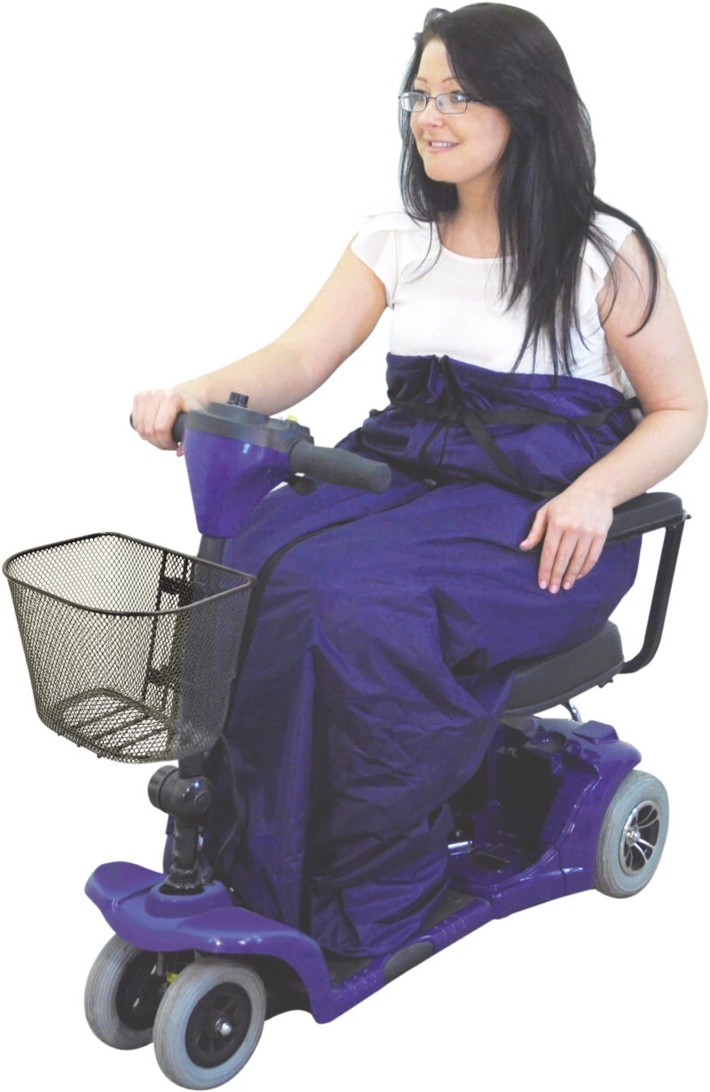 Person using a mobility scooter with a fleece-lined cosy.
