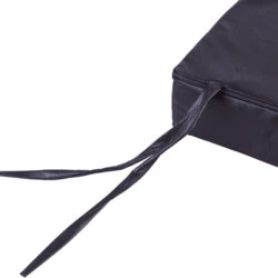 Close-up of a black wheelchair cushion with corner ties.