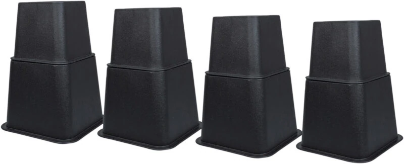 Four black furniture raisers arranged in a row.