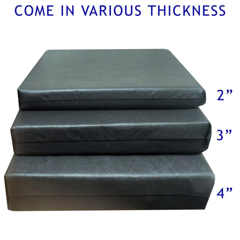 Three stacked wheelchair cushions in varying thicknesses: 2, 3, and 4 inches.