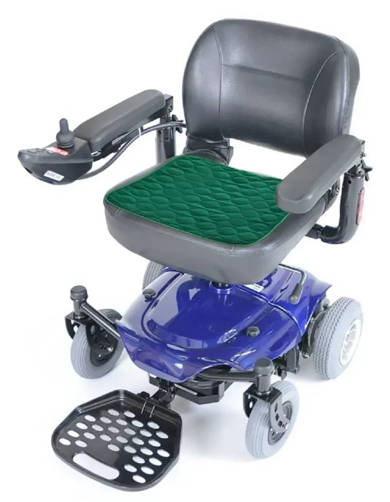 Green incontinence chair pad on a mobility scooter seat.