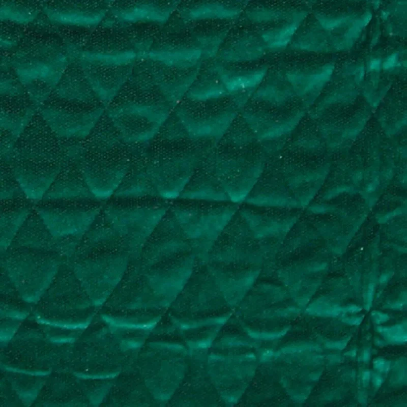 Close-up of green quilted fabric texture.