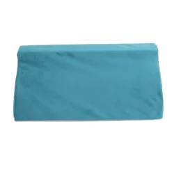 Teal wedge pillow with soft velvet cover.