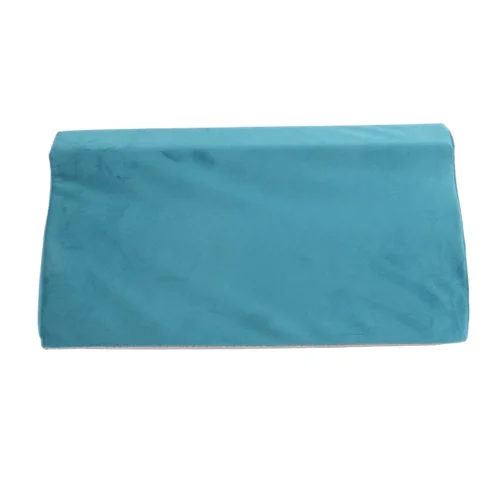 Teal wedge pillow with soft velvet cover.