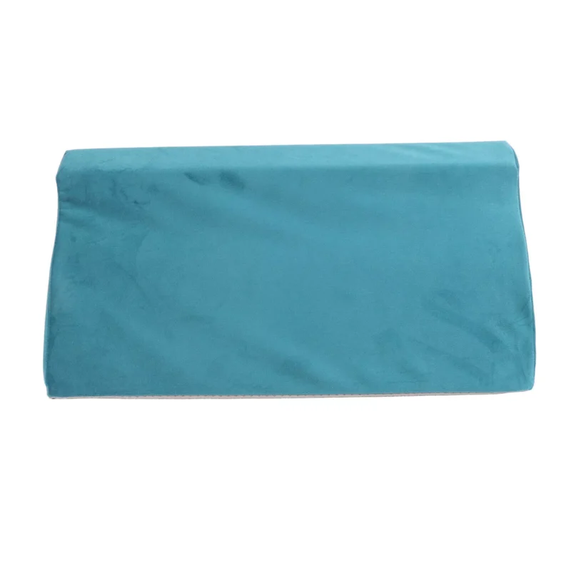 Teal wedge pillow with soft velvet cover.