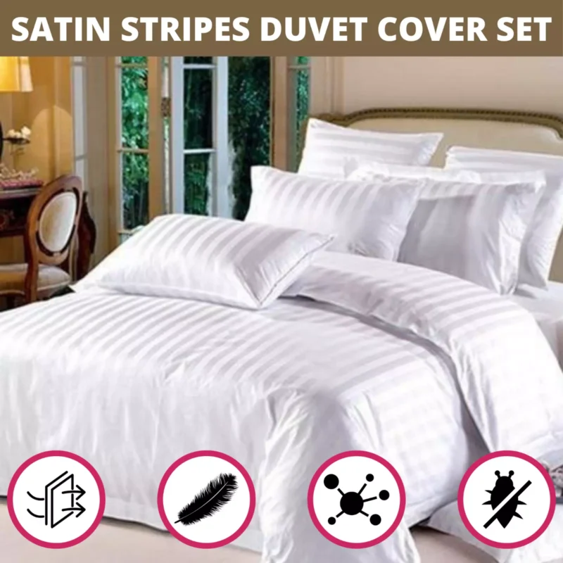 White satin striped duvet cover set on a bed with multiple pillows.