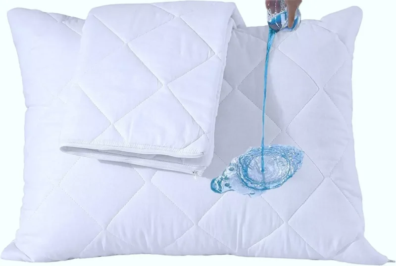Water being poured on a quilted pillow protector demonstrating waterproof feature.