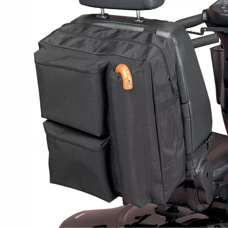 Black shopping bag attached to a mobility scooter seat.