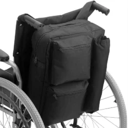 Black shopping bag attached to the back of a wheelchair.