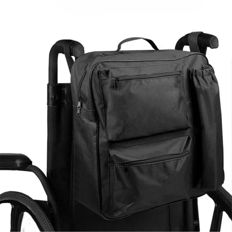 Black shopping bag attached to a mobility scooter.