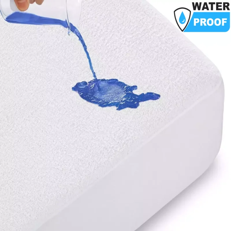 Blue liquid being poured on a white mattress protector.