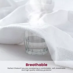 Steam rising from a glass under a white towel, showing breathability.