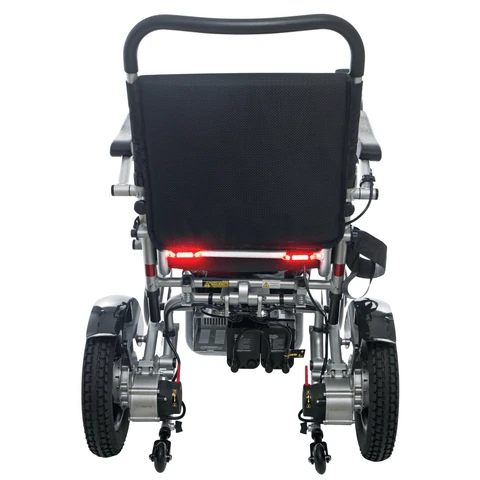 Rear view of a folding electric wheelchair showing wheels and frame.