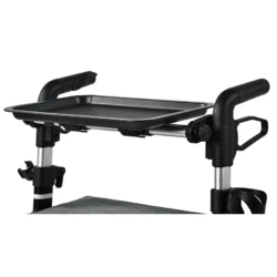 Tray accessory attached to a rollator walker.