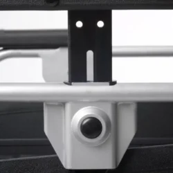 Close-up of the adjustable armrest mechanism on a wheelchair.