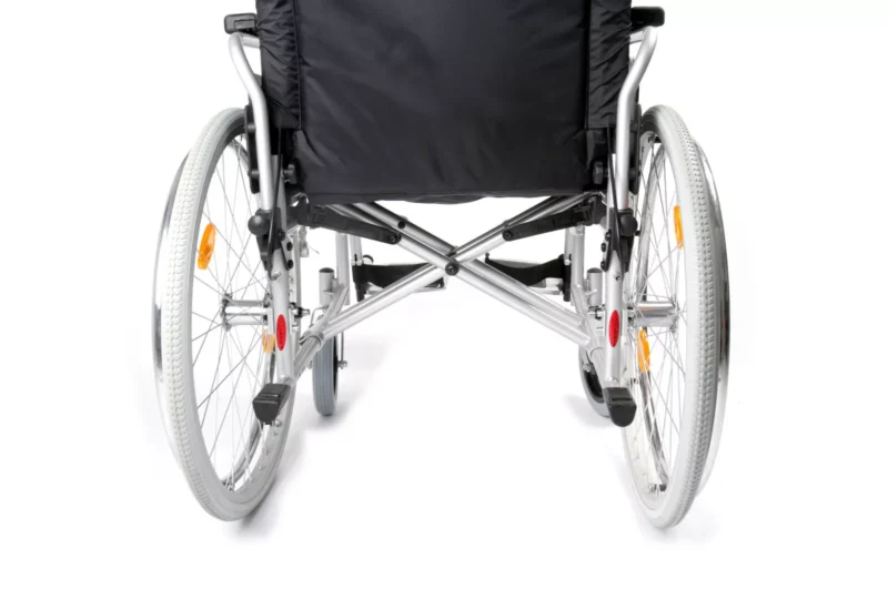 Rear view of a folding bariatric wheelchair with cross-braced steel frame.