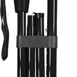 Folded black walking stick with a gel handle and wrist strap.