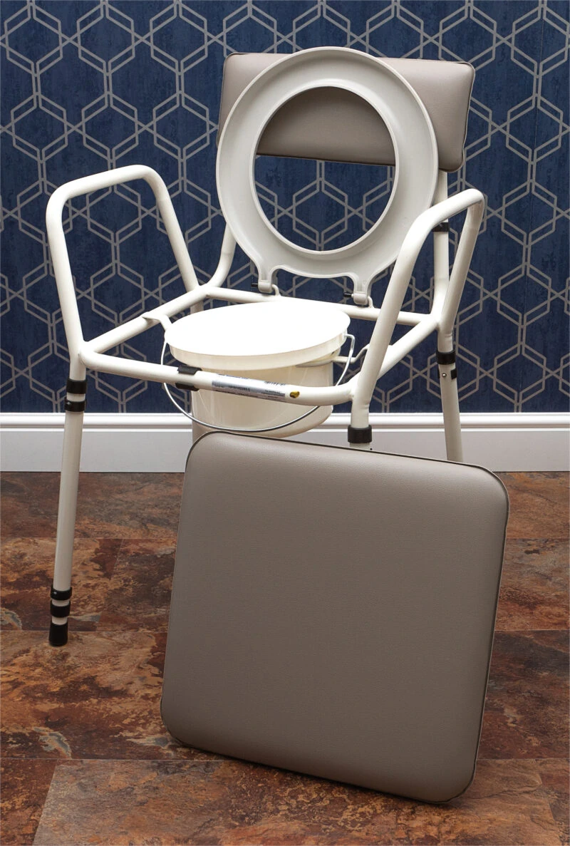 Height adjustable commode chair with detachable padded seat.