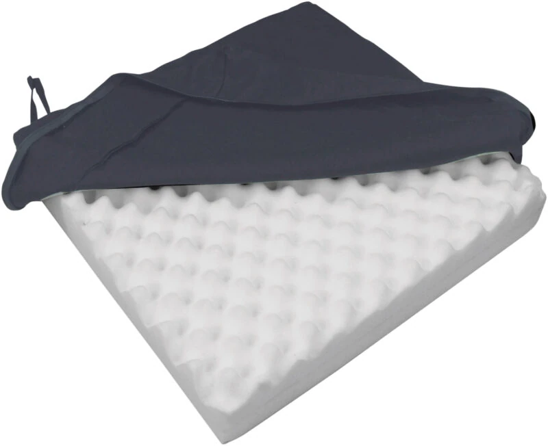 Orthopaedic seat cushion with eggcrate foam and black cover.