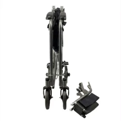 Folded transit wheelchair with detached footrests on white background.