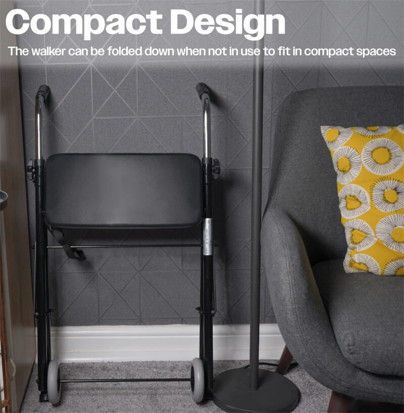 Foldable walker with seat folded against a wall in a living room.