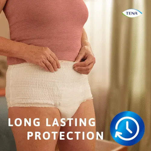 Person wearing Tena Pants Bariatric in a room with text 'Long Lasting Protection'.