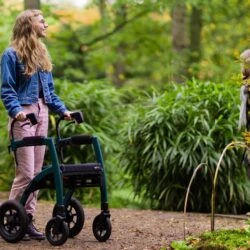 Person using Rollz Motion Performance walker on a forest path.