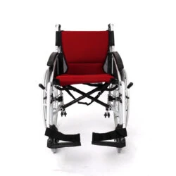 Front view of a red cushioned self-propelled wheelchair with adjustable armrests.