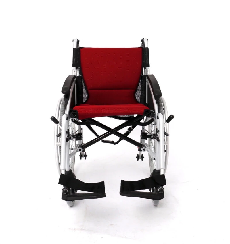 Front view of a red cushioned self-propelled wheelchair with adjustable armrests.
