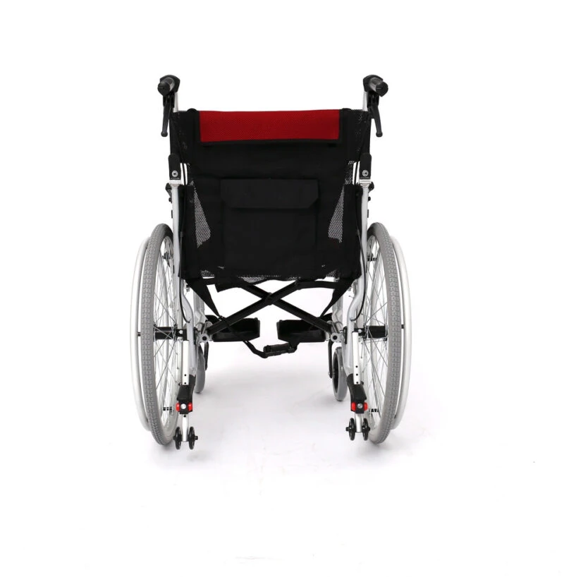 Rear view of a self-propelled wheelchair with red and black backrest.