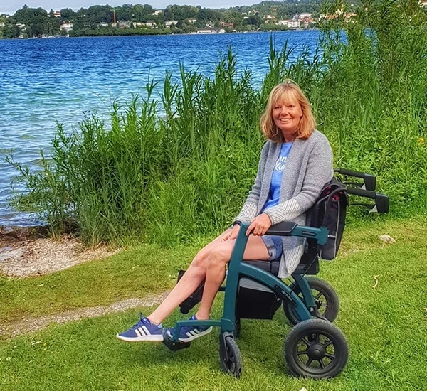 Person sitting in a Rollz Motion Performance wheelchair by a lake.