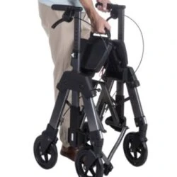Person holding a folded Bariatric EZ Fold N Go Rollator.