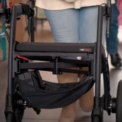 Person using a Rollz Motion Electric Rollator indoors.