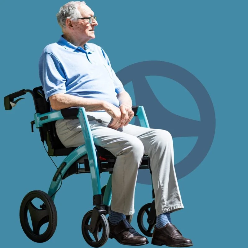 Person seated in a blue Rollz Motion 2.1 wheelchair against a blue background.