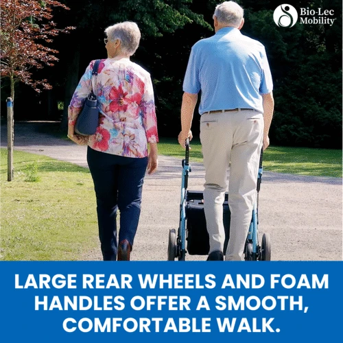 Two people walking outdoors, one using a rollator wheelchair.