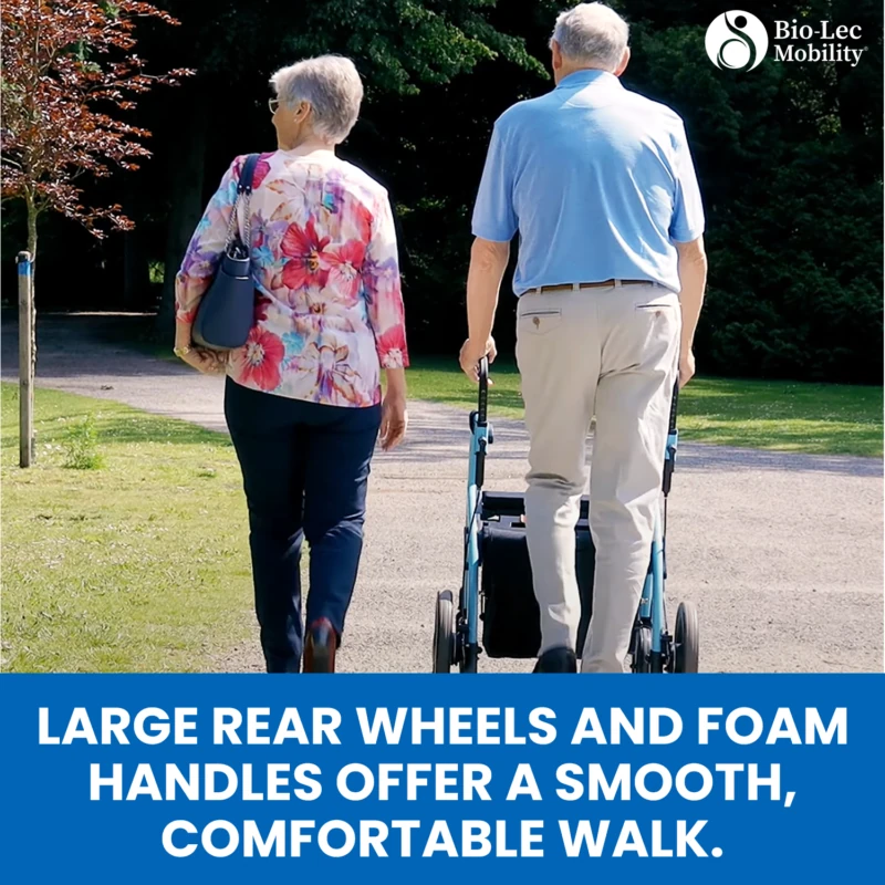 Two people walking outdoors, one using a rollator wheelchair.