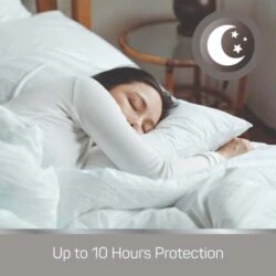 Woman sleeping peacefully with a moon and stars icon, text reads 'Up to 10 Hours Protection'.