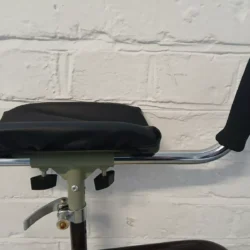 Close-up of forearm support handle with padded armrest and adjustable grip.