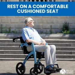 Man seated on a Rollator Wheelchair in front of steps.