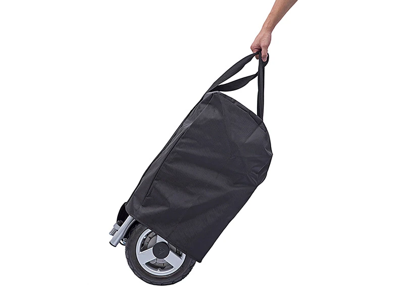 Freedom Chair DE08L wheel in a black travel bag being carried by a hand.