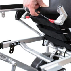 Close-up of a hand adjusting the wheelbase of the Freedom Scooter S1.