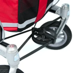 Close-up of the Trionic Walker 9er rear wheel and frame with red fabric.