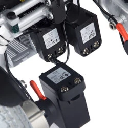 Close-up of the Freedom Chair A08's battery and wiring components.